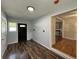 Functional mud room featuring new wood-look flooring and a convenient entryway to the kitchen and living spaces at 365 W Pine St, Varnville, SC 29944