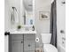 Well-lit bathroom with a gray vanity, framed mirror, and shower-tub combination with stylish curtain at 3769 Summerton St, Mount Pleasant, SC 29466