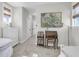 This bedroom boasts neutral tones, a stylish desk, modern art, and seamless access to the home's hallway at 3769 Summerton St, Mount Pleasant, SC 29466