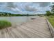 Wooden community dock by the serene lake, ideal for peaceful moments and reflections at 3769 Summerton St, Mount Pleasant, SC 29466