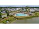Community pool and clubhouse overlooking the lake and neighborhood houses at 3769 Summerton St, Mount Pleasant, SC 29466