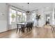 Open dining room with a modern chandelier, large windows, and hardwood floors at 3769 Summerton St, Mount Pleasant, SC 29466
