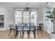 Bright dining room featuring a modern chandelier, large windows, and seating for six people at 3769 Summerton St, Mount Pleasant, SC 29466