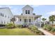 Inviting two-story home features a spacious front porch, well-manicured lawn, and classic white facade at 3769 Summerton St, Mount Pleasant, SC 29466