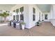Inviting front porch with rocking chairs, potted plants, and wood flooring, perfect for relaxation at 3769 Summerton St, Mount Pleasant, SC 29466
