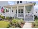 Beautiful two-story home with a charming front porch, perfect for enjoying the outdoors and neighborhood views at 3769 Summerton St, Mount Pleasant, SC 29466