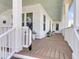 Expansive front porch featuring a light blue ceiling and wood floors offers ample room for outdoor relaxation at 3769 Summerton St, Mount Pleasant, SC 29466