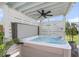 Inviting hot tub under a pergola with overhead fan, providing a private and relaxing outdoor space at 3769 Summerton St, Mount Pleasant, SC 29466