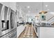 Bright and modern kitchen with white cabinetry, stainless steel appliances, and an island with bar seating at 3769 Summerton St, Mount Pleasant, SC 29466