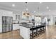 Bright kitchen features a large center island with bar seating, stainless appliances, and modern lighting at 3769 Summerton St, Mount Pleasant, SC 29466