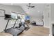 Versatile living space featuring gym equipment, a TV, bright windows, and comfortable seating for relaxation at 3769 Summerton St, Mount Pleasant, SC 29466