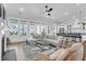 Spacious living room opens to the kitchen, featuring hardwood floors and natural lighting at 3769 Summerton St, Mount Pleasant, SC 29466