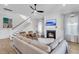 Open-concept living room features a fireplace, staircase, and hardwood floors for a modern design at 3769 Summerton St, Mount Pleasant, SC 29466