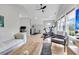 A versatile living space features exercise equipment, wet bar and sink, recessed lights and bright windows at 3769 Summerton St, Mount Pleasant, SC 29466