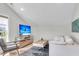 Comfortable living area featuring a soft white couch, modern TV setup, and a stylish, textured rug at 3769 Summerton St, Mount Pleasant, SC 29466