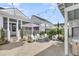 Inviting outdoor patio with stylish seating, string lights, and landscaping for relaxing gatherings at 3769 Summerton St, Mount Pleasant, SC 29466