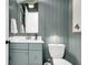 Stylish powder room with beadboard walls, gold hardware, and a modern faucet at 3769 Summerton St, Mount Pleasant, SC 29466