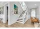 Bright staircase with white trim and view into the living room at 3769 Summerton St, Mount Pleasant, SC 29466