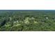 An overhead view shows homes surrounded by an abundance of lush greenery and mature trees at 395 Summerset Ln, Summerville, SC 29483