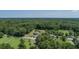 Scenic aerial view features a unique round house nestled amongst lush green foliage at 395 Summerset Ln, Summerville, SC 29483