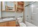 Bathroom featuring tile shower, vanity with storage, and granite countertop at 395 Summerset Ln, Summerville, SC 29483