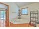 Bright bathroom with a jacuzzi tub, wood-trimmed walls, and natural light from a window at 395 Summerset Ln, Summerville, SC 29483