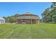 Round house exterior featuring open yard and unique design with surrounding greenery at 395 Summerset Ln, Summerville, SC 29483