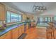 Bright, open kitchen with granite countertops, stainless steel appliances, custom cabinets, and seamless connection to the living area at 395 Summerset Ln, Summerville, SC 29483