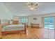Large main bedroom with hardwood floors, desk area, and access to a private outdoor space at 395 Summerset Ln, Summerville, SC 29483