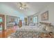 Spacious main bedroom with vaulted ceilings, hardwood floors, and sliding mirrored closet at 395 Summerset Ln, Summerville, SC 29483