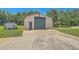 Exterior of a utility outbuilding on a concrete pad in a grassy yard at 395 Summerset Ln, Summerville, SC 29483