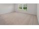 Spacious bedroom with plush carpeting and natural light streaming through large windows at 425 W Respite Ln, Summerville, SC 29483