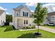 Beautiful two-story home featuring a covered front porch and landscaped front yard at 425 W Respite Ln, Summerville, SC 29483