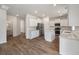 Modern kitchen with stainless appliances, white cabinets, and hardwood floors at 425 W Respite Ln, Summerville, SC 29483
