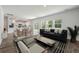 Open-concept living room with hardwood floors, neutral walls, and natural light at 425 W Respite Ln, Summerville, SC 29483