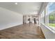 Open-concept living space with hardwood floors and large windows at 425 W Respite Ln, Summerville, SC 29483