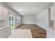Open living space featuring hardwood floors and seamless access to a modern kitchen at 425 W Respite Ln, Summerville, SC 29483