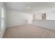Bright and open loft area with neutral carpet, perfect for relaxation or entertainment at 425 W Respite Ln, Summerville, SC 29483