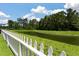 Scenic view of a pond from behind a white picket fence at 425 W Respite Ln, Summerville, SC 29483