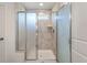 Modern shower with neutral tile surround and glass enclosure in updated bathroom at 425 W Respite Ln, Summerville, SC 29483