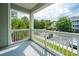 Wide view from balcony showing building, trees, and parking lot at 45 Scyamore Ave # 623, Charleston, SC 29407