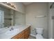 Bathroom with white sink, toilet, and large mirror at 45 Scyamore Ave # 623, Charleston, SC 29407