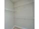 Walk-in closet featuring white wire shelving and light wood-look flooring at 45 Scyamore Ave # 623, Charleston, SC 29407