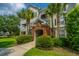 Three-story apartment building with brick entryway and mature landscaping at 45 Scyamore Ave # 623, Charleston, SC 29407