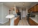 Functional kitchen with ample wood cabinets, stainless steel appliances, and a breakfast bar at 45 Scyamore Ave # 623, Charleston, SC 29407