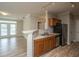 Kitchen with stainless steel appliances, breakfast bar, and hardwood floors at 45 Scyamore Ave # 623, Charleston, SC 29407