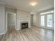 Inviting living room with a fireplace and balcony access at 45 Scyamore Ave # 623, Charleston, SC 29407