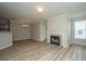 Bright, open living room with fireplace, light wood flooring, and neutral walls at 45 Scyamore Ave # 623, Charleston, SC 29407