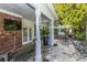 Outdoor patio with brick flooring, a TV, grill, and outdoor dining area at 45 Scyamore Ave # 623, Charleston, SC 29407