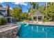 Beautiful community pool with a gazebo and lounge chairs, surrounded by lush greenery at 45 Scyamore Ave # 623, Charleston, SC 29407